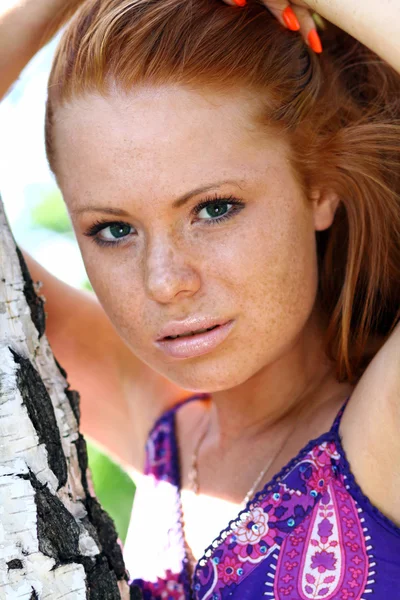 Beautiful redhead woman in a dress — Stock Photo, Image