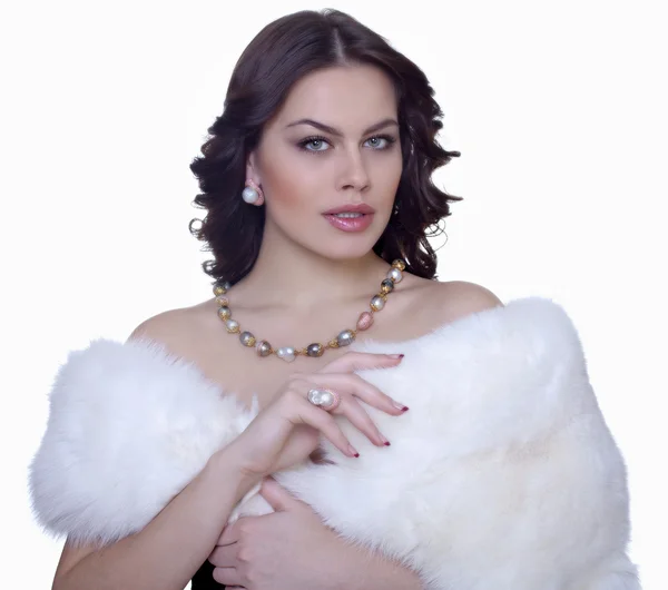 Portrait of attractive brunette in a fur coat — Stock Photo, Image