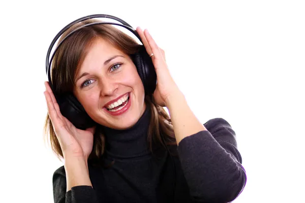 Happy young woman listening to music — Stock Photo, Image