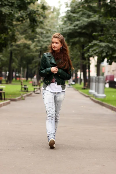 Full length, walking woman in autumn park Royalty Free Stock Images