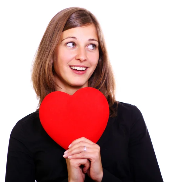 Portrait of a attractive young woman holding a red heart — Stock Photo, Image