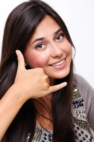 Beautiful woman making a call me gesture — Stock Photo, Image