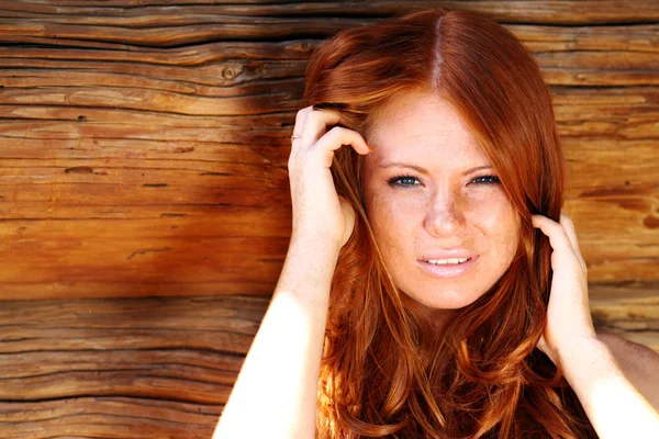 Portrait of the beautiful red-haired girl Stock Picture