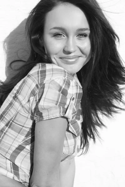 Young happy woman in cell shirt — Stock Photo, Image