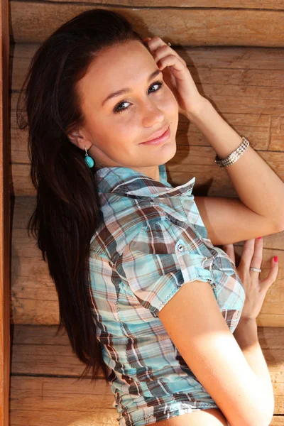 Young happy woman in cell shirt — Stock Photo, Image