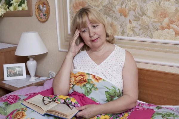 Old woman suffering with fever in the bedroom — Stock Photo, Image