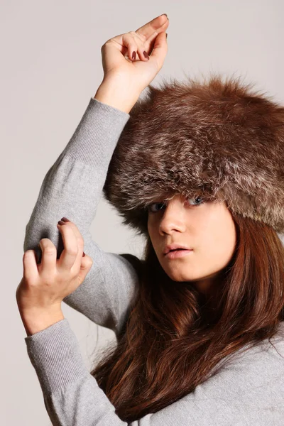 Young woman in a furry hat — Stock Photo, Image