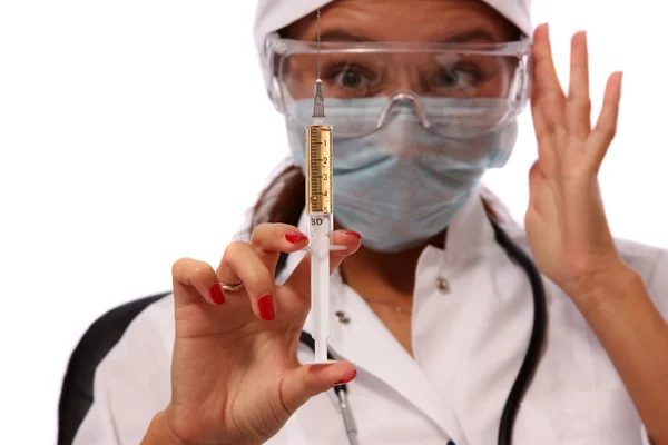 Young female Hispanic nurse in a lab coat — Stock Photo, Image