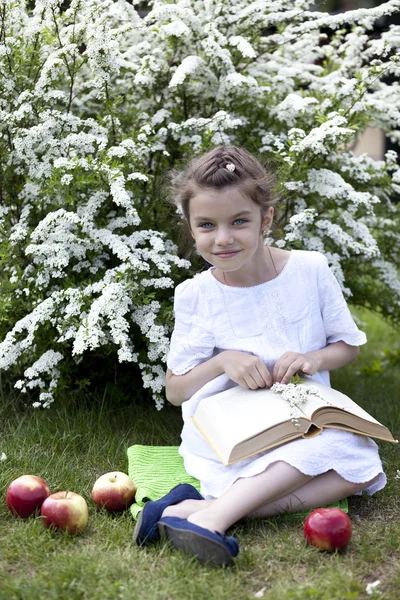 stock image Portrait of beautiful little girl in spring blossom