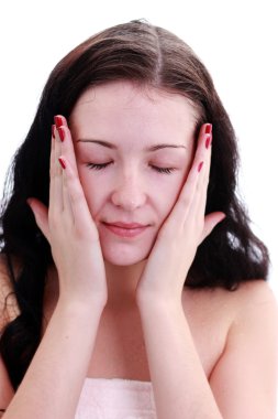Closeup portrait of beautiful woman caring of her face