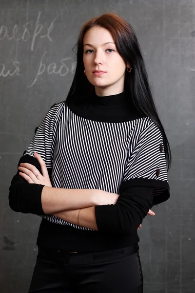 Female teacher in classroom — Stock Photo, Image