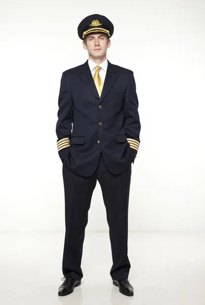 Young man in the form of a passenger plane pilot — Stock Photo, Image