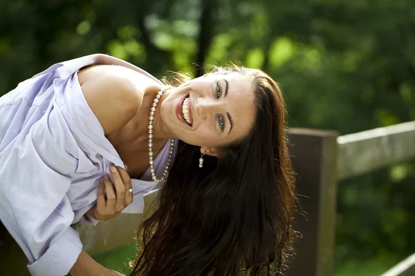 Sexy young Brunette in a summer park — Stock Photo, Image