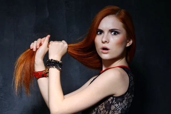 Young beautiful woman in studio — Stock Photo, Image