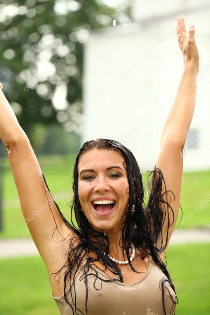 Young happy woman walking in the rain — Stock Photo ...