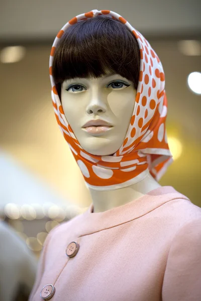 Portrait of female mannequin in orange scarf — Stock Photo, Image
