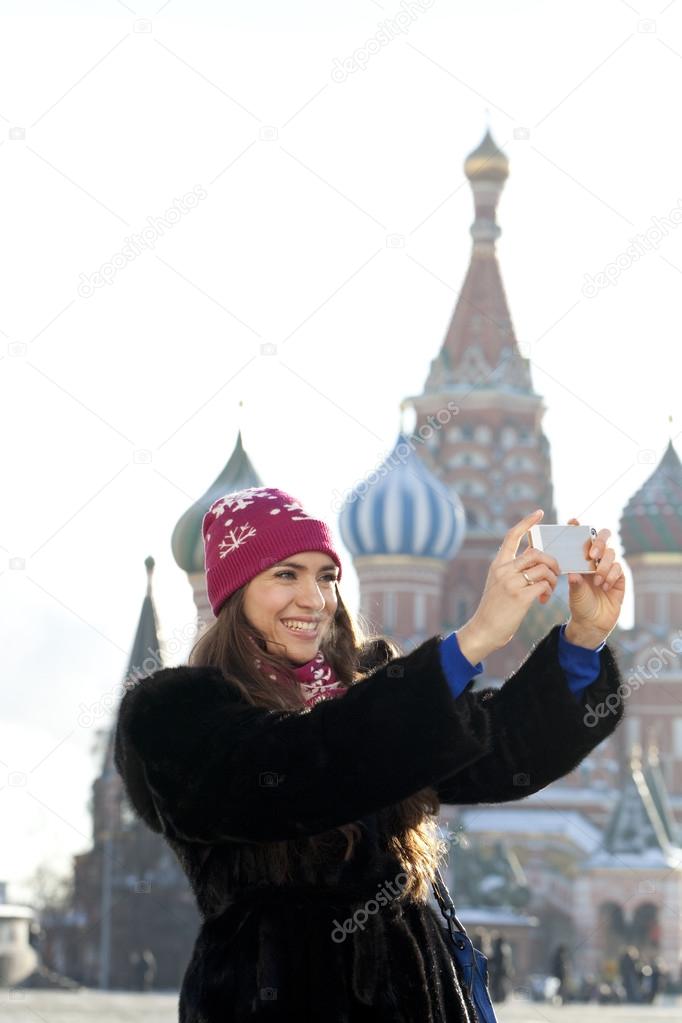 Young woman photographed attractions in Moscow