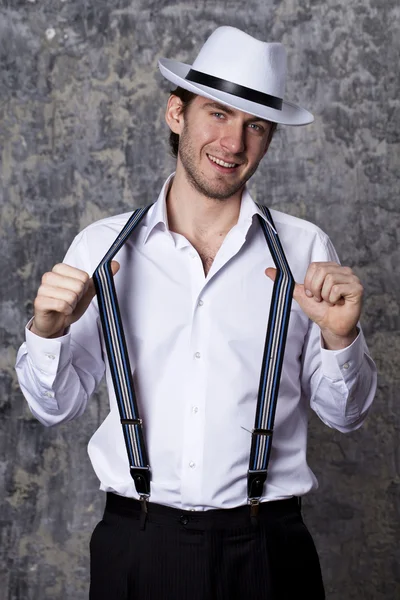 Young man in a white shirt and cowboy hat — Stock Photo, Image