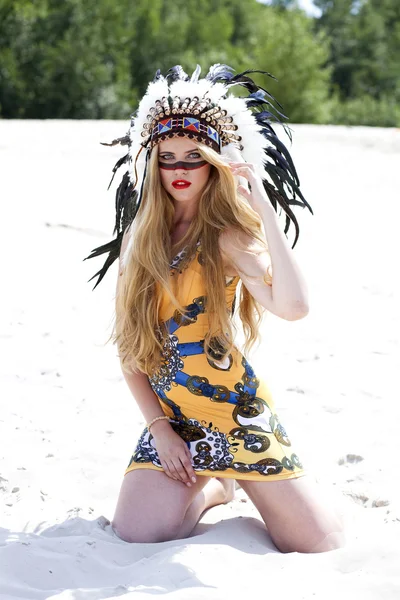 Blonde woman in costume of American Indian — Stock Photo, Image