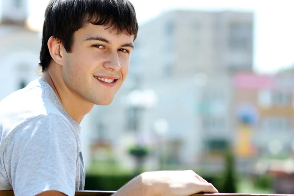 Portrait of a handsome man in summer park — Stock Photo, Image