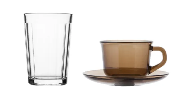 Teetasse und facettiertes Glas — Stockfoto