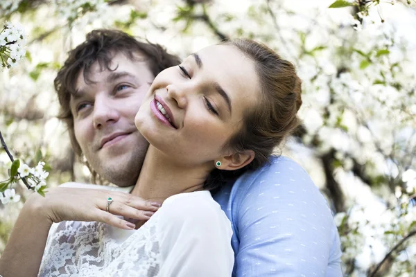 Embracing couple in spring nature closeup portrait — Stock Photo, Image