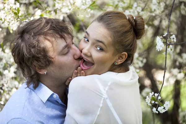 Embracing couple in spring nature closeup portrait — Stock Photo, Image