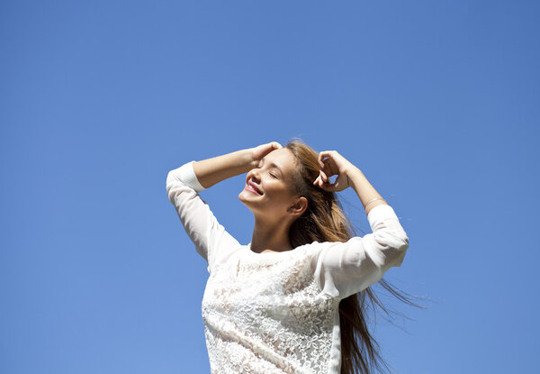 Upwards view of young woman enjoying life 