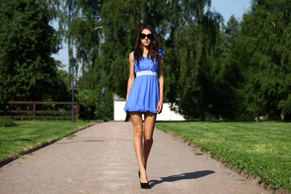 Happy young woman walking on the summer park — Stock Photo, Image