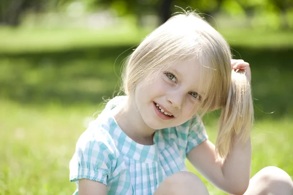 Portrait of a beautiful blonde little girl three years — Stock Photo, Image