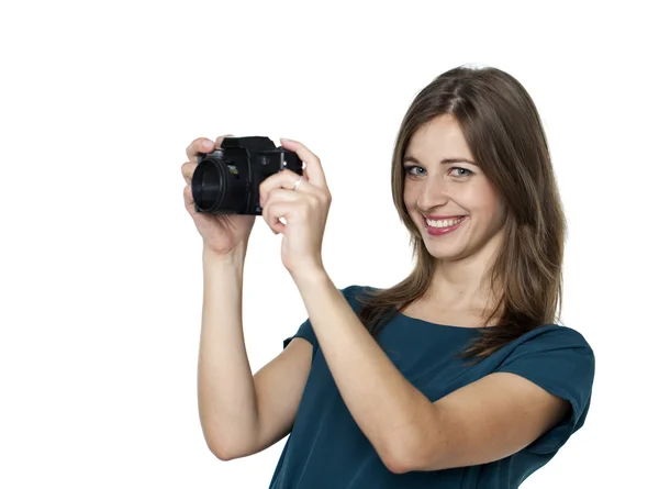 Happy young woman using a camera to take photo — Stock Photo, Image