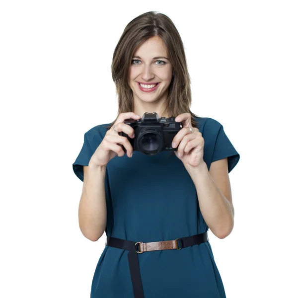 Happy young woman using a camera to take photo — Stock Photo, Image