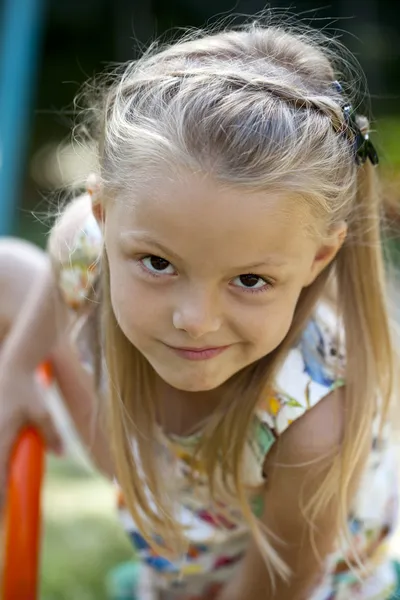 Little happy girl in summer park — Stock Photo, Image