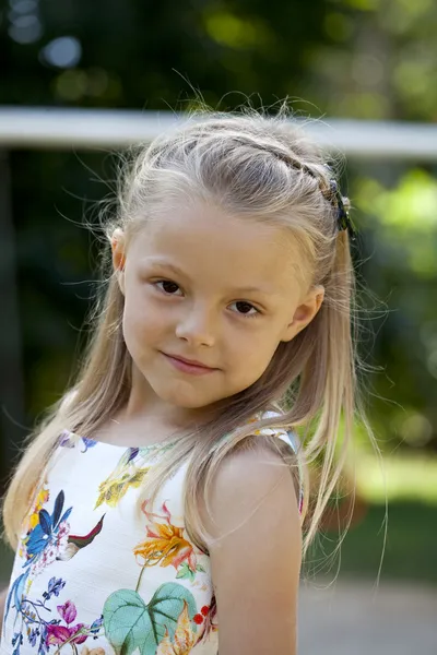 Little happy girl in summer park — Stock Photo, Image