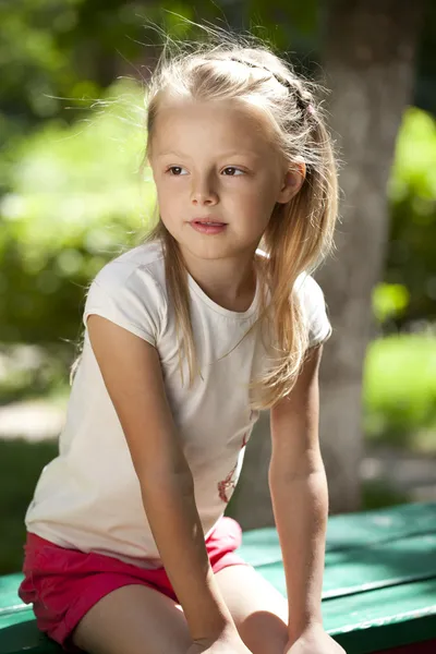 Little happy girl in summer park — Stock Photo, Image