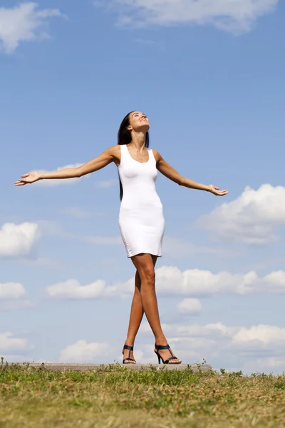 Beautiful young woman in white sexy dress — Stock Photo, Image