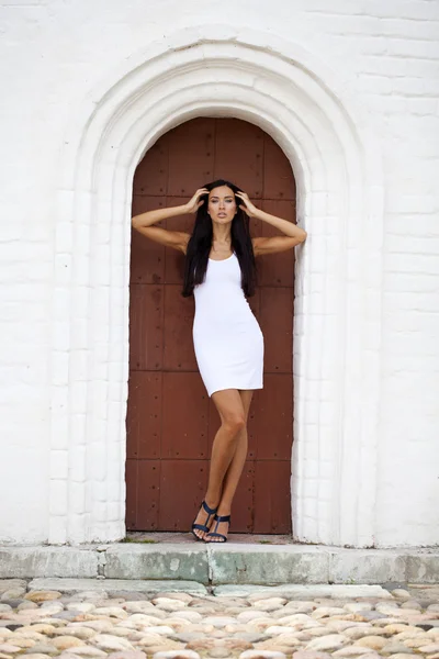 Beautiful young woman in white sexy dress — Stock Photo, Image