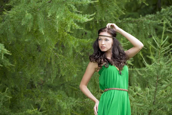 Beautiful young woman in green dress — Stock Photo, Image