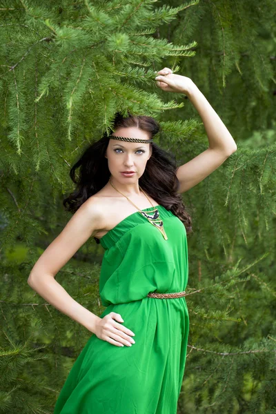 Beautiful young woman in green dress — Stock Photo, Image