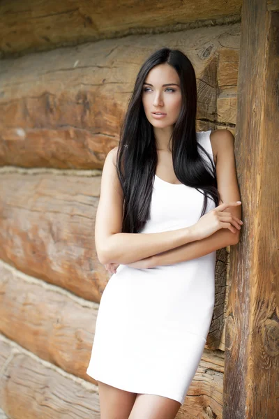 Beautiful young woman in white sexy dress — Stock Photo, Image