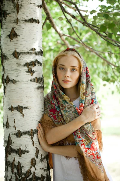 Beauty woman in the national patterned scarf — Stock Photo, Image