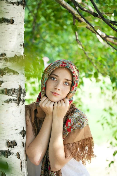 Beauty woman in the national patterned scarf Royalty Free Stock Photos