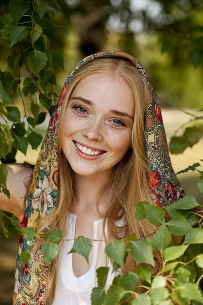 Beauty woman in the national patterned scarf — Stock Photo, Image