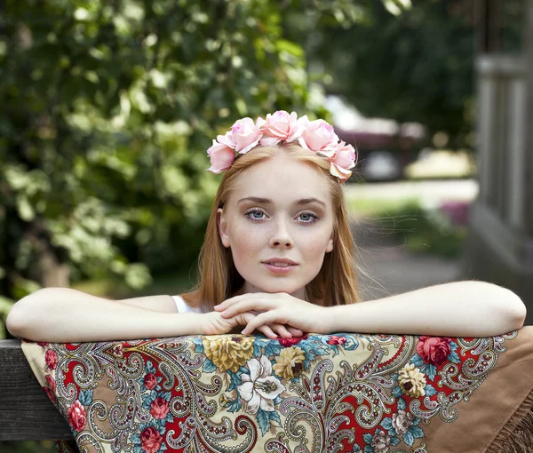 Beauty woman in the national patterned scarf — Stock Photo, Image