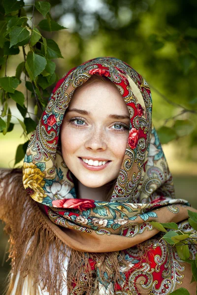 Beauty woman in the national patterned scarf — Stock Photo, Image