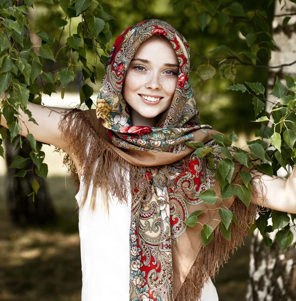 Beauty woman in the national patterned scarf — Stock Photo, Image