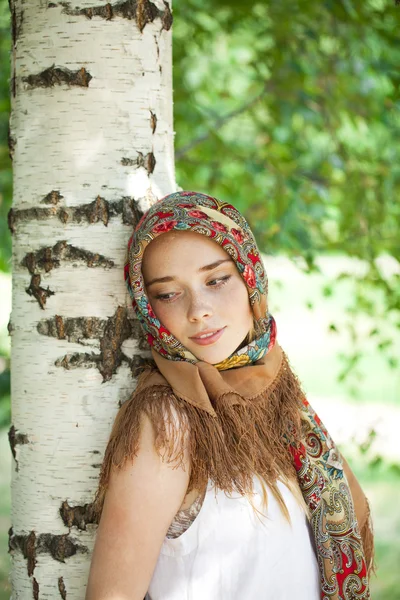 Beauty woman in the national patterned scarf — Stock Photo, Image