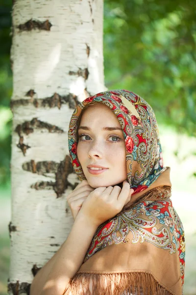 Beauty woman in the national patterned scarf — Stock Photo, Image