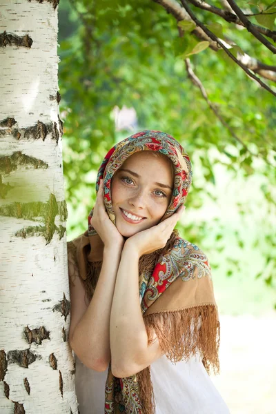 Beauty woman in the national patterned scarf — Stock Photo, Image