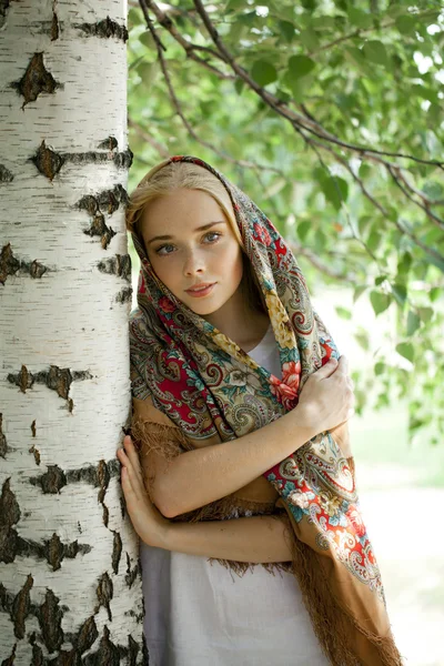 Beauty woman in the national patterned scarf — Stock Photo, Image